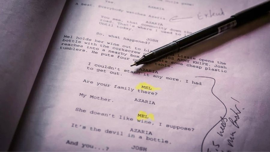 A screenplay page with dialogue, marked up with a pen and highlighter